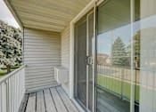 Thumbnail 31 of 31 - A sliding glass door with a screen on the side of a house.