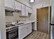Thumbnail 10 of 21 - the preserve at ballantyne commons apartment kitchen with stainless steel appliances