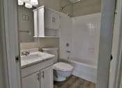 Thumbnail 14 of 21 - a bathroom with a sink toilet and a shower