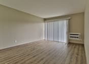 Thumbnail 3 of 21 - an empty living room with blinds and a window