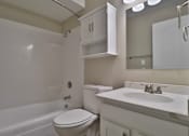 Thumbnail 9 of 21 - a bathroom with a sink toilet and a bath tub