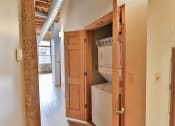 Thumbnail 21 of 35 - a laundry room with a washer and dryer in a house