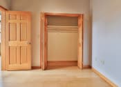 Thumbnail 32 of 35 - an empty room with a closet and a door open