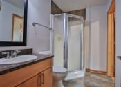 Thumbnail 35 of 35 - a bathroom with a shower and a sink and a toilet