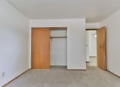Thumbnail 14 of 33 - an empty room with a closet and a door in it
