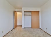 Thumbnail 24 of 33 - A room with a white door and a brown door.