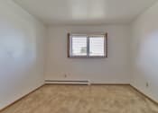 Thumbnail 25 of 33 - the bedroom of an empty house with a window
