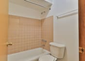 Thumbnail 30 of 33 - a private bathroom with a toilet and a bath tub