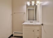 Thumbnail 27 of 43 - a small bathroom with a sink and a mirror