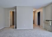 Thumbnail 33 of 43 - an empty living room with an open door to a bedroom