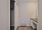 Thumbnail 34 of 43 - an empty room with a kitchen and a closet
