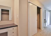Thumbnail 35 of 43 - a bathroom with a mirror and a closet