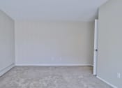 Thumbnail 32 of 43 - an empty room with white walls and carpet