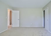 Thumbnail 41 of 43 - an empty room with white walls and a door to a closet