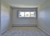 Thumbnail 40 of 43 - an empty room with a window and white walls
