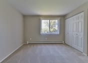 Thumbnail 9 of 15 - an empty room with two doors and a window