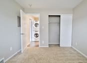Thumbnail 35 of 39 - A laundry room with a washer and dryer.