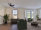 Thumbnail 5 of 93 - A living room with a ceiling fan and a green chair.