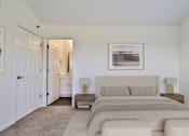 Thumbnail 11 of 93 - A bedroom with a large bed and a painting on the wall.