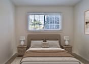 Thumbnail 28 of 31 - A bedroom with a large bed and two lamps on either side.