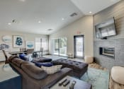 Thumbnail 6 of 43 - a living room with a fireplace and a tv