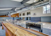Thumbnail 1 of 43 - a large room with a foosball table and ping pong table