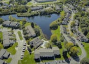 Thumbnail 43 of 43 - an aerial view of a neighborhood with a lake in the background