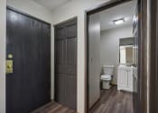 Thumbnail 25 of 44 - a bathroom with a toilet and a black door