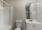 Thumbnail 24 of 44 - a bathroom with a sink toilet and a mirror