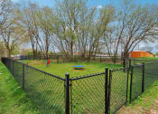 Thumbnail 44 of 44 - a fenced in dog park with a dog