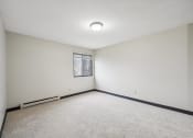 Thumbnail 12 of 44 - an empty room with white walls and a window