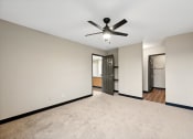 Thumbnail 36 of 44 - the living room is empty and has a ceiling fan