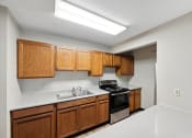 Thumbnail 29 of 44 - the preserve at ballantyne commons clubhouse kitchen with stove and sink