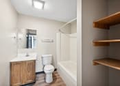 Thumbnail 41 of 44 - a bathroom with a toilet and a shower and a sink