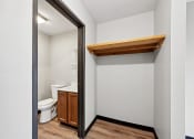 Thumbnail 43 of 44 - a bathroom with a toilet and a mirror