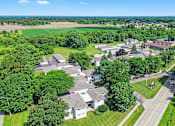 Thumbnail 11 of 52 - A bird's eye view of a residential area with houses and trees.