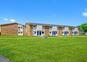 Thumbnail 2 of 52 - A row of houses with blue doors and windows.