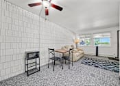 Thumbnail 25 of 52 - A room with a white brick wall and a ceiling fan.