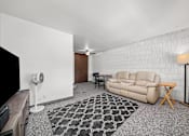 Thumbnail 40 of 52 - A living room with a grey carpet and a white wall.