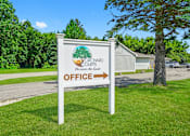 Thumbnail 19 of 52 - A sign for the Yorkshire Couris office stands in a grassy area.