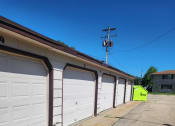 Thumbnail 15 of 15 - a row of garage doors on the side of a building