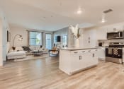 Thumbnail 38 of 69 - a kitchen and living room with hardwood floors