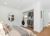 Thumbnail 10 of 23 - Spacious bedroom in Mar Vista apartment with large closet, washer/dryer, plank flooring and private bathroom