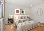 Thumbnail 9 of 23 - Spacious bedroom in Mar Vista apartment with plank flooring and large windows allowing for gorgeous natural lighting