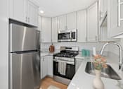 Thumbnail 6 of 23 - Modern kitchen in Mar Vista apartment home with shaker cabinets, gorgeous finishes and state-of-the-art appliances
