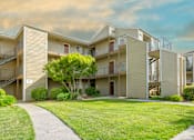 Thumbnail 16 of 37 - Charming exterior of California Place apartments with grass lined walkways and lush greenery, providing a beautiful and serene living experience!