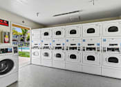 Thumbnail 28 of 30 - community laundry center at Azusa Gardens Apartments