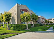 Thumbnail 2 of 30 - Azusa Gardens Building Exterior with Park-Like Landscaping