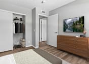 Thumbnail 26 of 30 - Second bedroom in 2 Bed 1 Bath Azusa Gardens apartment home with wood-style plank, large window and closet.