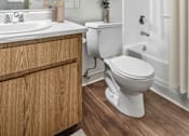 Thumbnail 31 of 31 - Second Bathroom in Bent Tree 2 Bed 2 Bath apartment home with wood plank-style flooring, light cabinetry, a large vanity mirror and a shower/tub